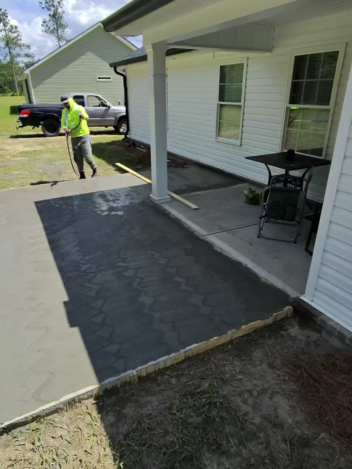 Finished concrete patio extension in Savannah GA off the back porch
