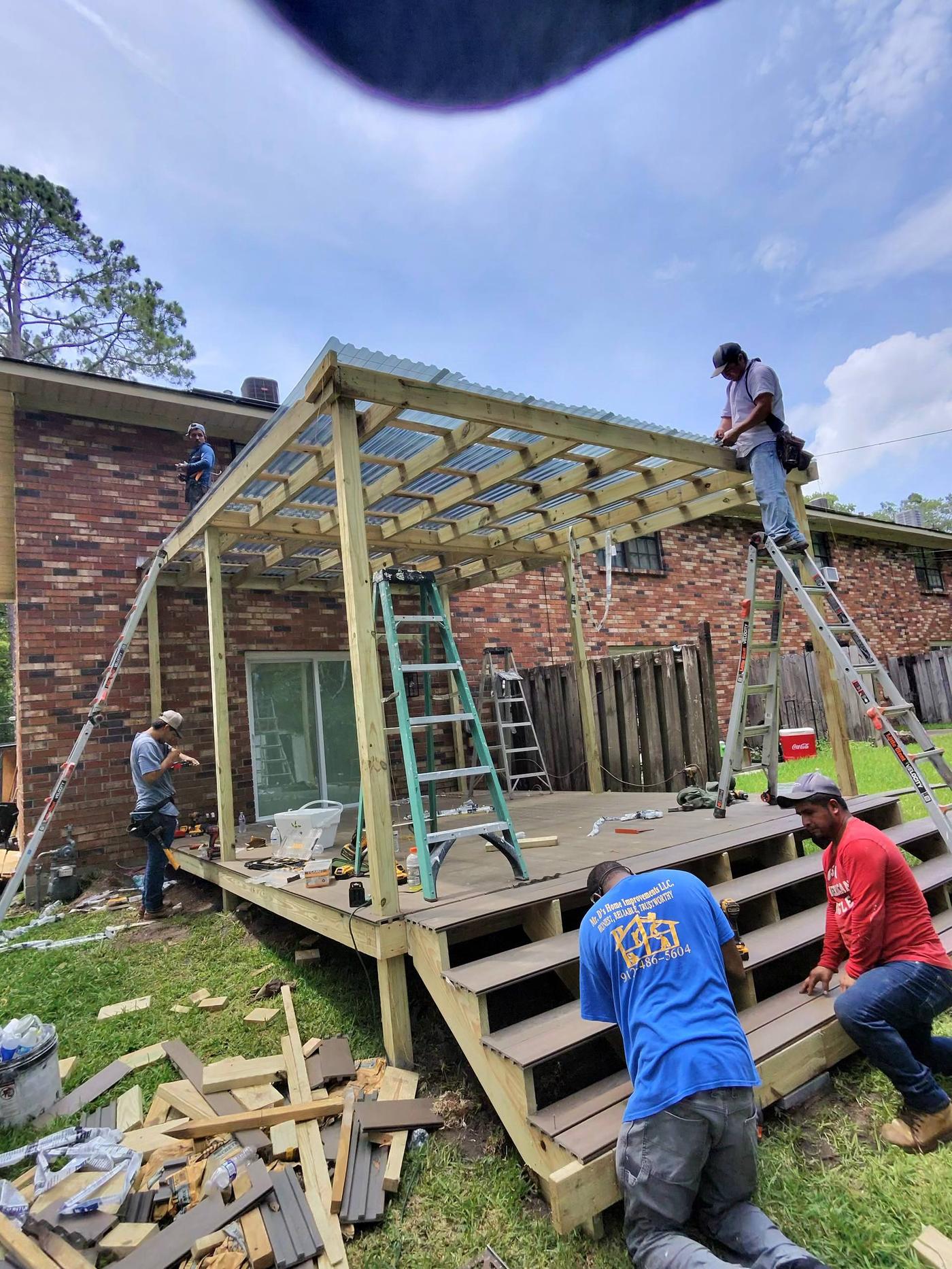 Deck construction crew framing and building a composite deck in Savannah GA