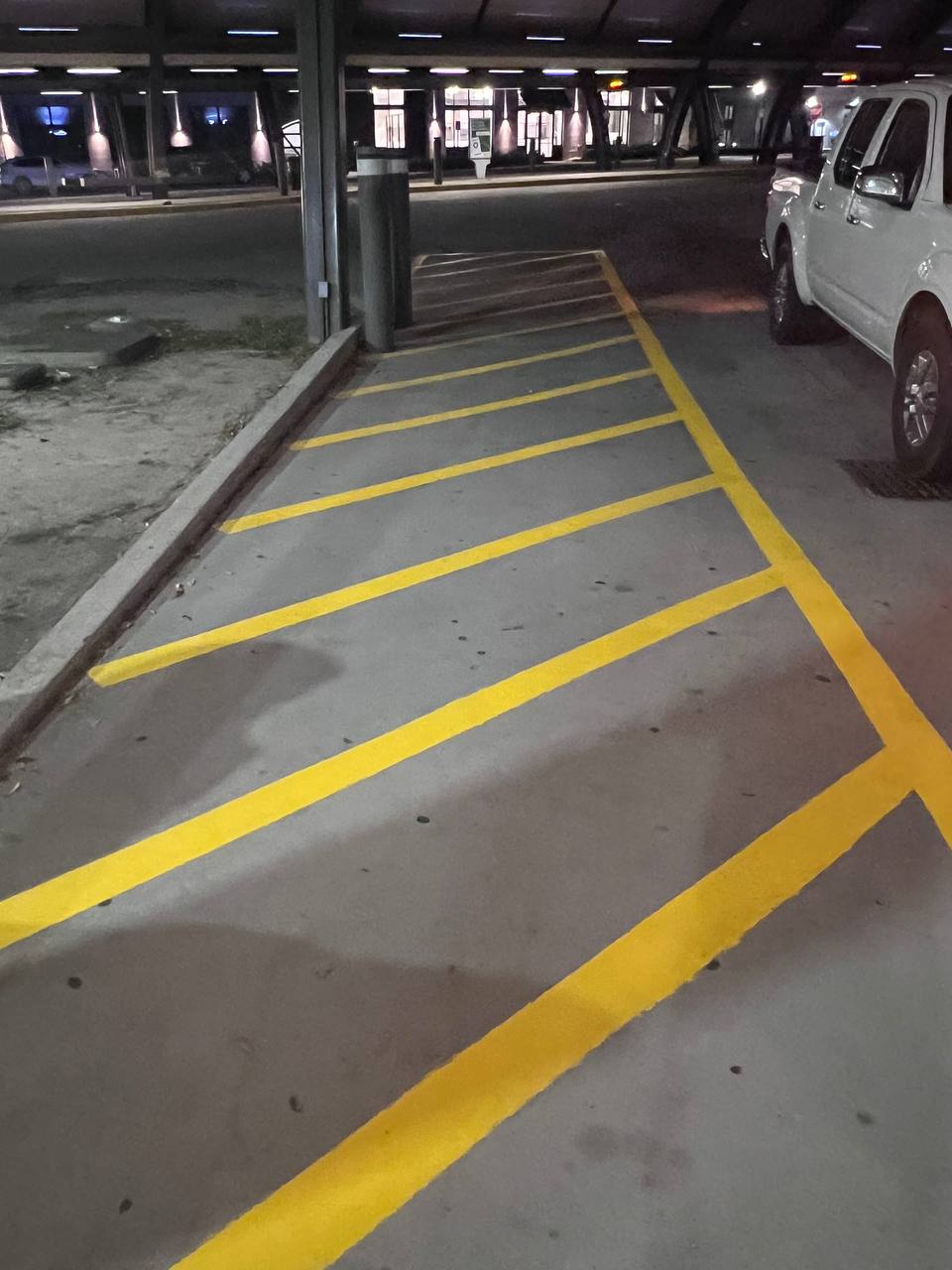 Fresh yellow safety markings at bus bay CAT Station Savannah