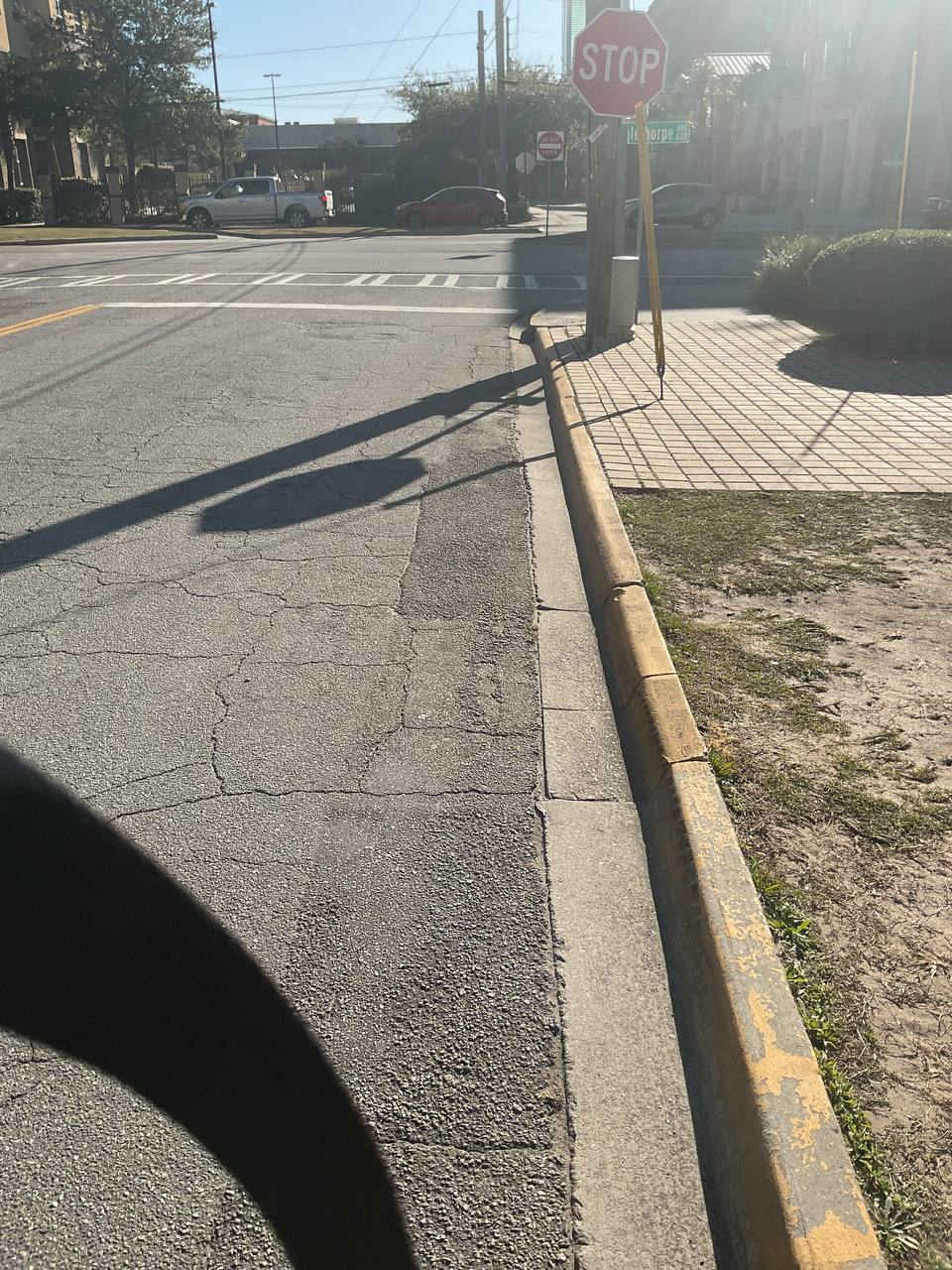 Worn bus bay safety markings before commercial painting at Savannah transit center
