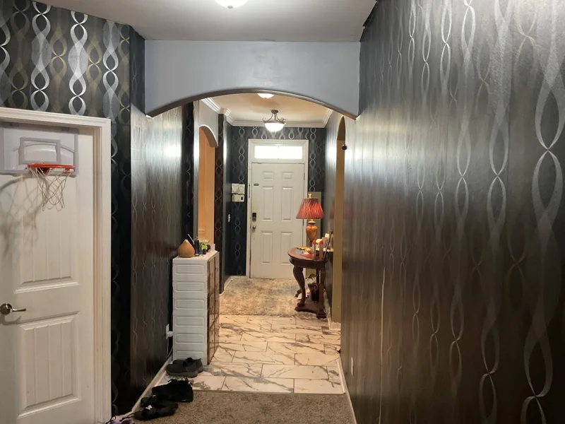 Hallway with old patterned wallpaper