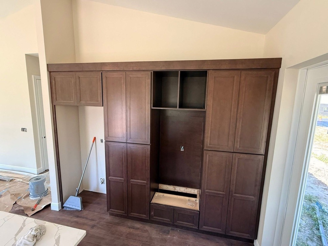 Custom entertainment built-in wall with stained doors