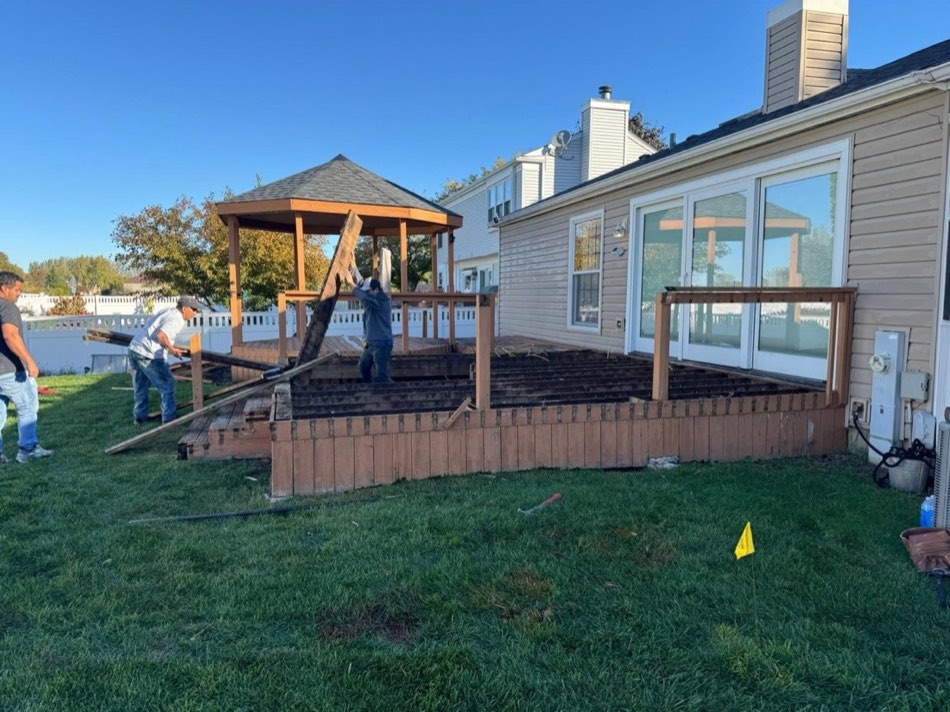 Crew working on a deck rebuild around a gazebo
