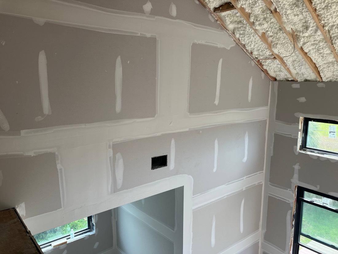 Vaulted wall fully taped and mudded, every joint visible