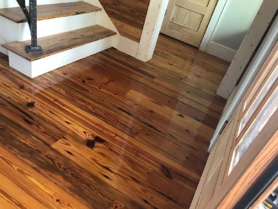 Refinished heart-pine floor at staircase entry