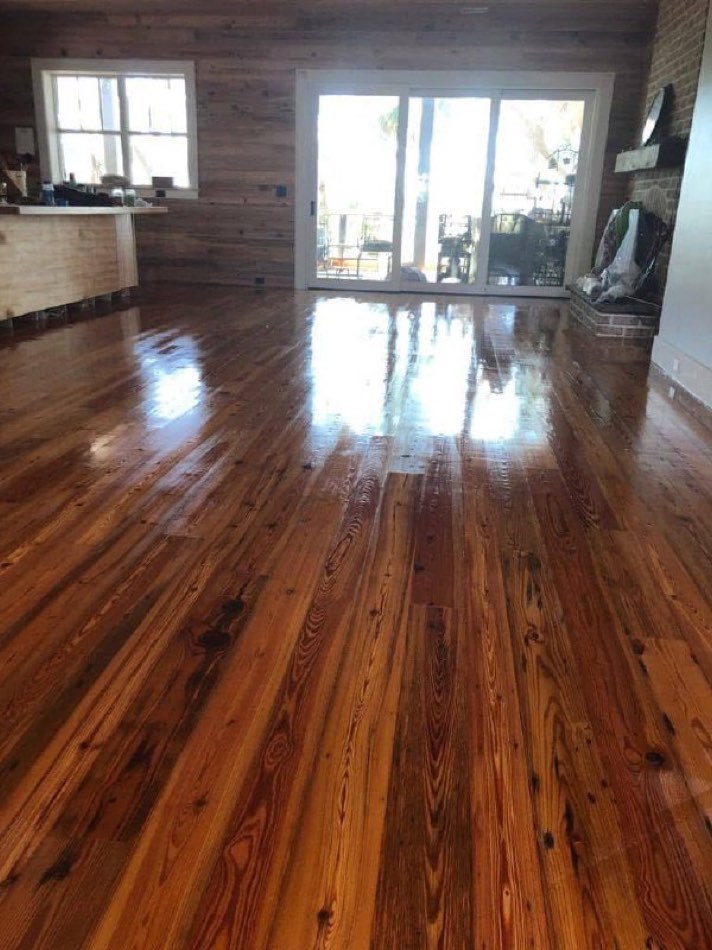 Large refinished pine floor with sliders, glossy finish