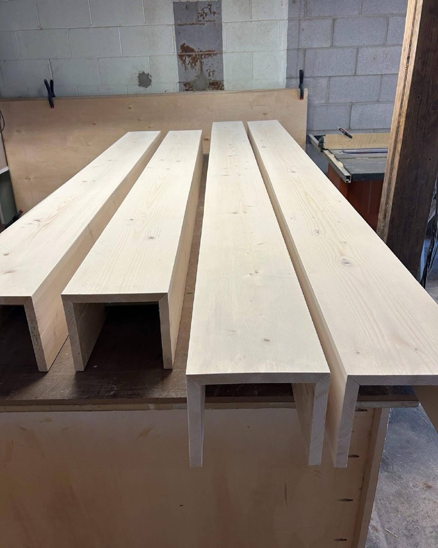 Raw box-beam lumber prepped in workshop