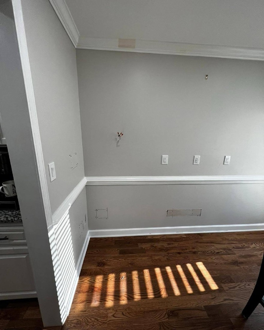Chair rail and crown molding installed in a dining area